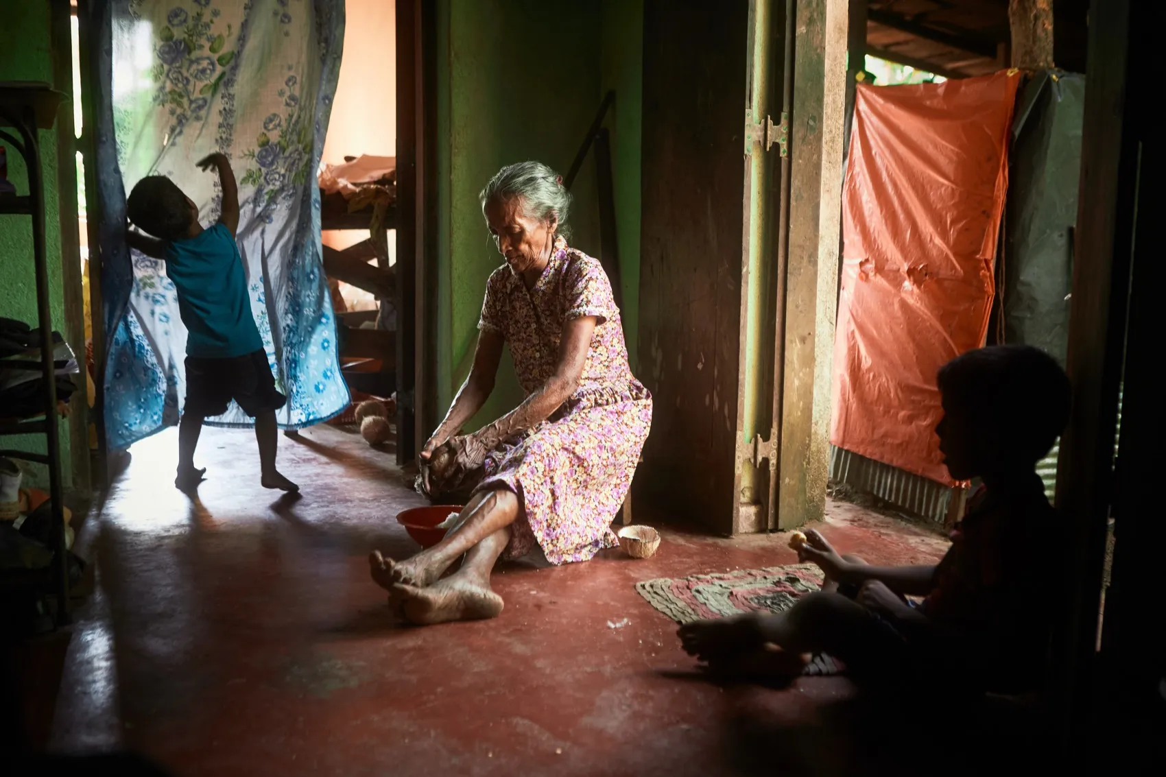 Interior of a house, an older woman and a child