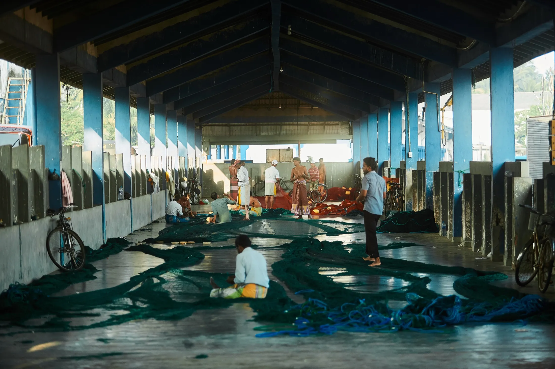 The long covered hall where nets are spread on the floor
